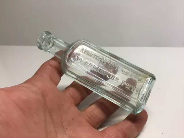 Antique Aqua Lighting Hot Drops Bottle. No Relief No Pay.