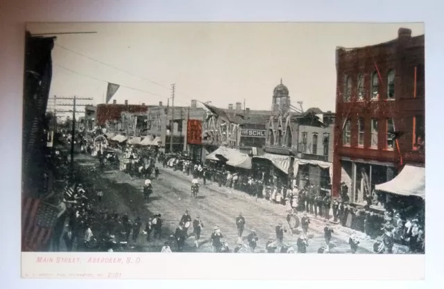 1910s  POSTCARD ABERDEEN S. Dakota Main Street Circus Parade Downtown Unsent