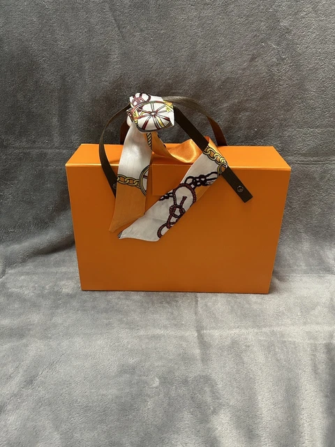 Orange gift box with small scarf