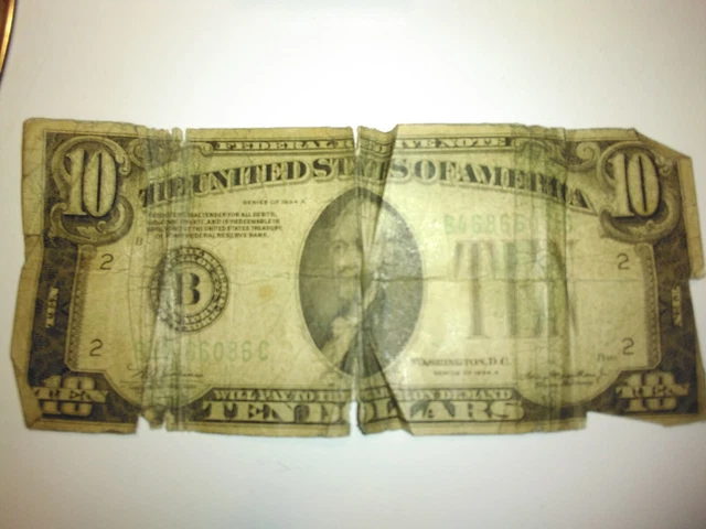 1934A SILVER CERTIFICATE BLUE SEAL TEN DOLLAR STAR NOTE. A little ware and tear.