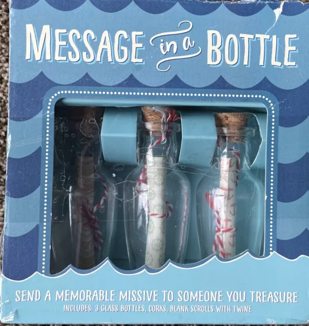 Kit de 3 piezas Mensaje en una botella. 3 botellas de vidrio, desplazamiento y corcho. La caja está doblada