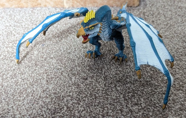 A cute wooden blue dragon figurine - image created in