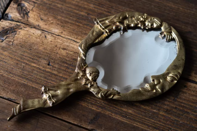 Miroir à main ancien bronze harlequin lune verre biseauté