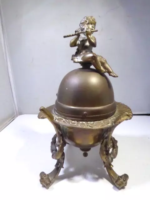 Antique French Bronze Egg Shaped Box Topped With A Putti Playing Flute