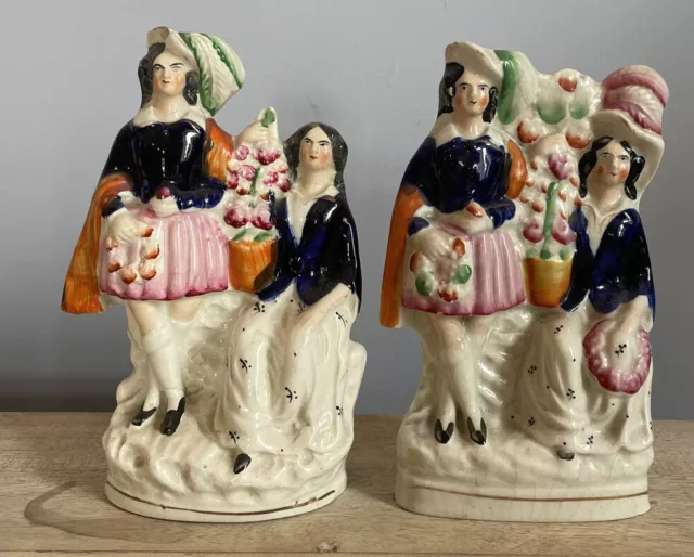 A Pair Of Victorian Staffordshire Pottery Figurines.