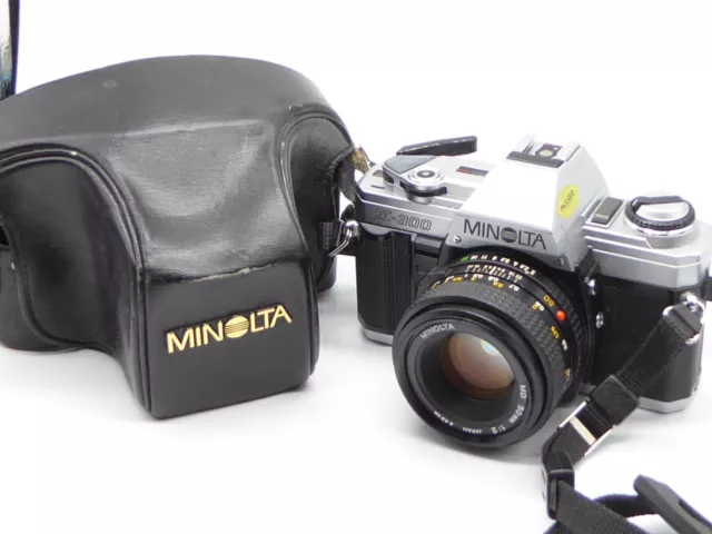Minolta X-300 Classic Auto Manual SLR Camera & 50mm f2 Minolta MD Lens new seals