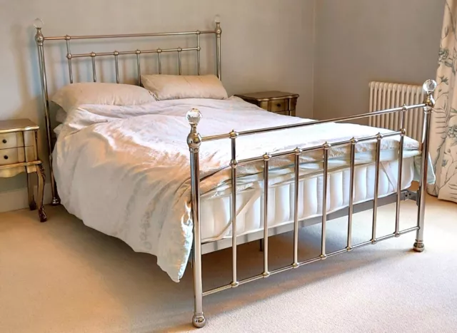 Chrome nickel antique Victorian-style kingsize bed frame with crystal finials.