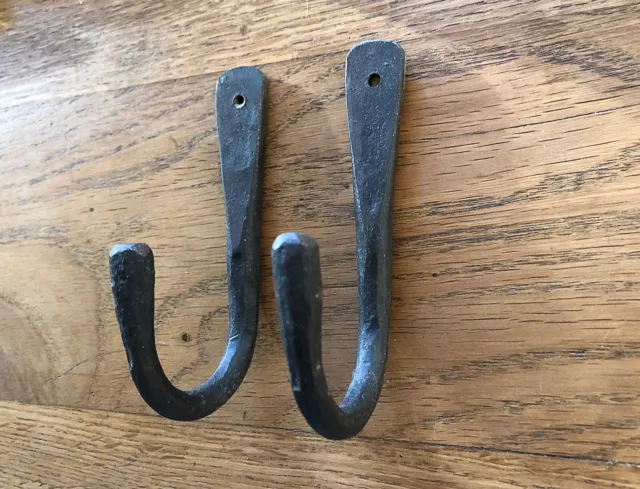 A pair of lovely hand made wrought iron blacksmiths hook