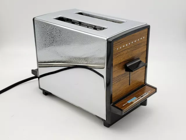 https://www.picclickimg.com/Hg4AAOSwAr1k7SMG/Vintage-FARBERWARE-2-Slice-Toaster-with-Chrome-Wood-Grain.webp