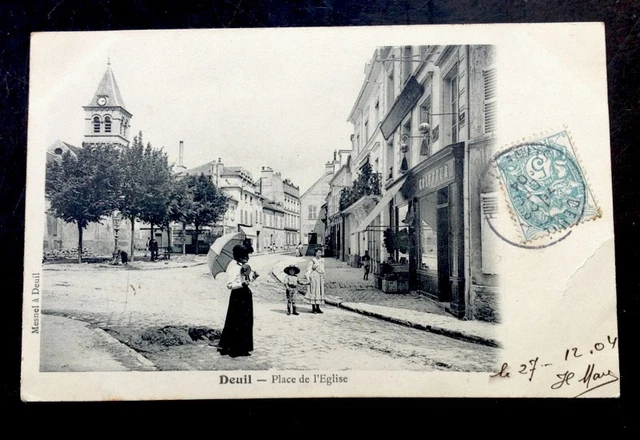 CPA. DEUIL. 95 - Place de l'Eglise. 1904. Coiffeur. Enseignes.