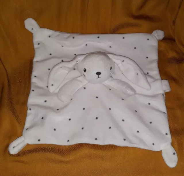 Ju23 - DOUDOU LAPIN SIMBA BLANC ETOILES GRISES ATTACHE TETINE en parfait état