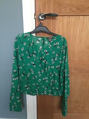 Girls long sleeved flower top size 12 - 13 years great condition