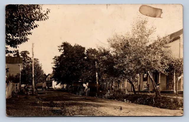 J87/ Jerusalem Ohio RPPC Postcard c1910 Woodsfield Store Homes  809