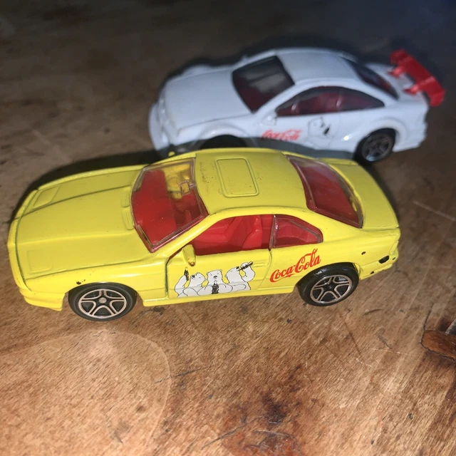 Set 2 Lot Matchbox 1992 yellow BMW 850i & 1996 white Opal Calibra Coca Cola Bear