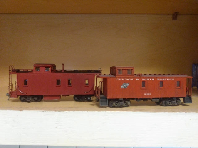 2 Built Ho Wood Styrene Caboose  1 Painted CNW  w Trucks VG