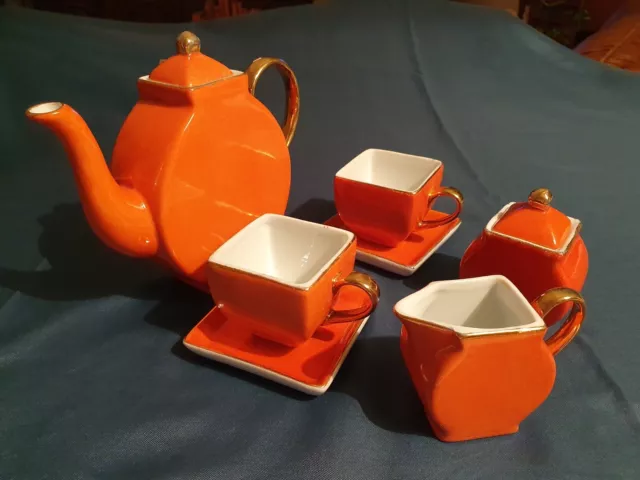 Ensemble service à café en porcelaine orange et doré