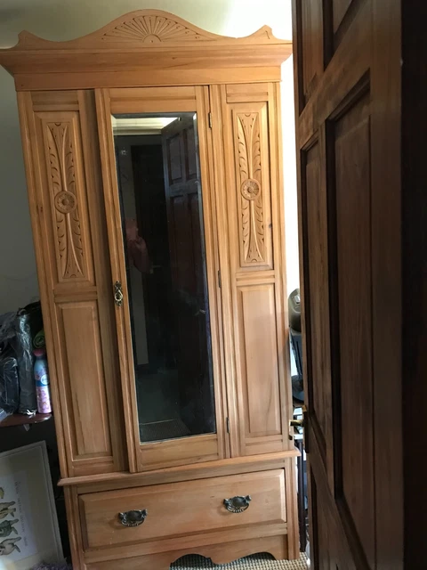 Antique wooden wardrobe; mirror, large, deep drawer and brass handles.