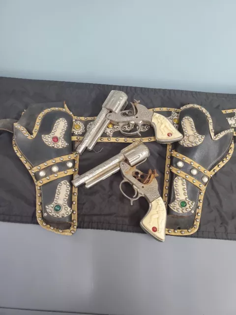 Vintage 1940s Stevens Cowboy King toy cast nickel repeater pistols with holsters