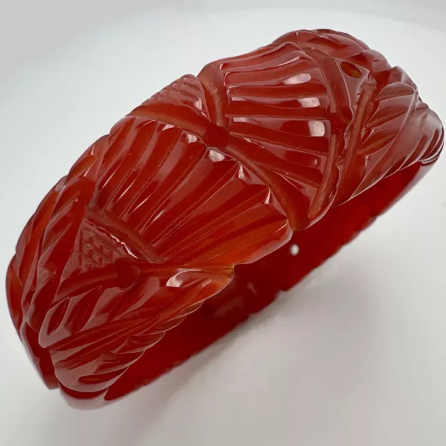 Vintage Art Deco Heavily Carved Translucent Red Bakelite Flower Bangle Bracelet