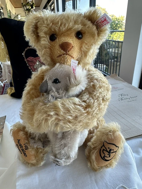 Teddy bear with button outlet in ear