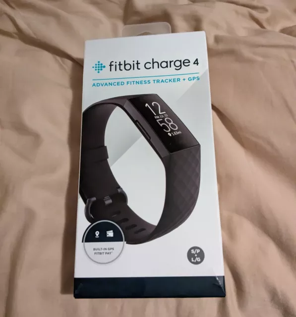 Fitbit Charge 4 Black with Charger, Large Band and box , works great!