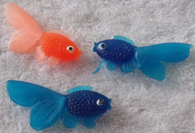 One Orange and Two Blue Rubber Fish Toy Figures