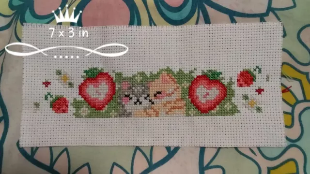completed unframed cross stitch kittens and strawberries
