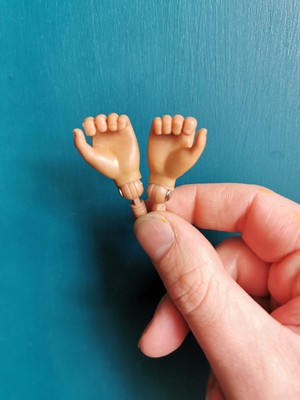 action man with gripping hands