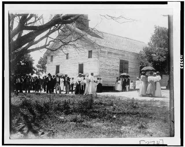 Photo:African American men,women,children outside of church