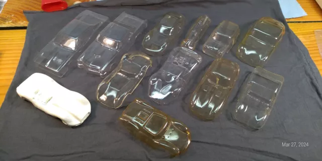 13 plastic bodies, Jaguar, Abarth, Mini, Lister, Lotus, Chev, Charger, etc