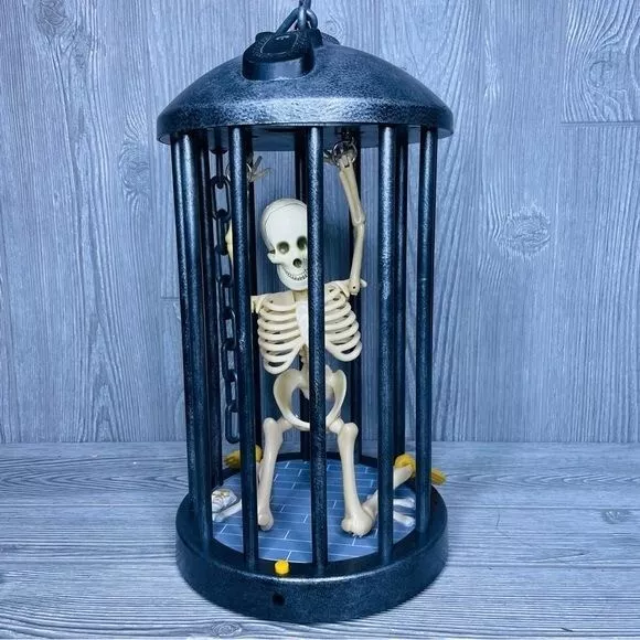 Gemmy collectible skeleton in cage animated Halloween prop decoration