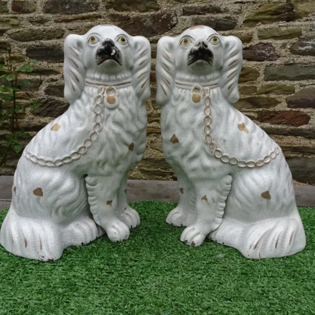 19thC PAIR: STAFFORDSHIRE WHITE & GILT SPANIEL DOGS: SEPARATE FRONT LEGS c1880s