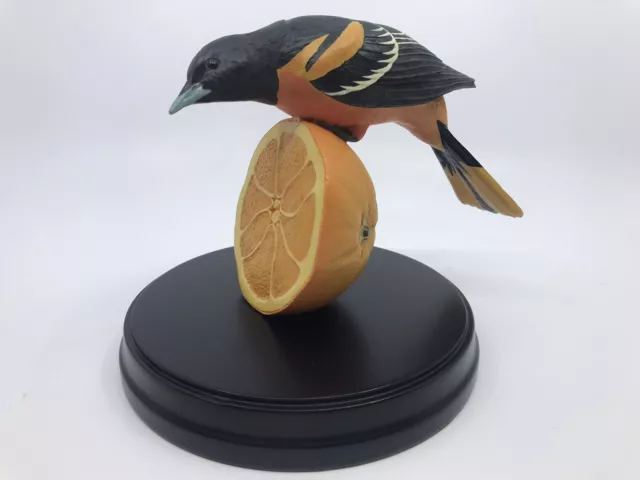 Loon Lake Decoy Company Oriole Bird Perched on an Orange Crow Springs Collection