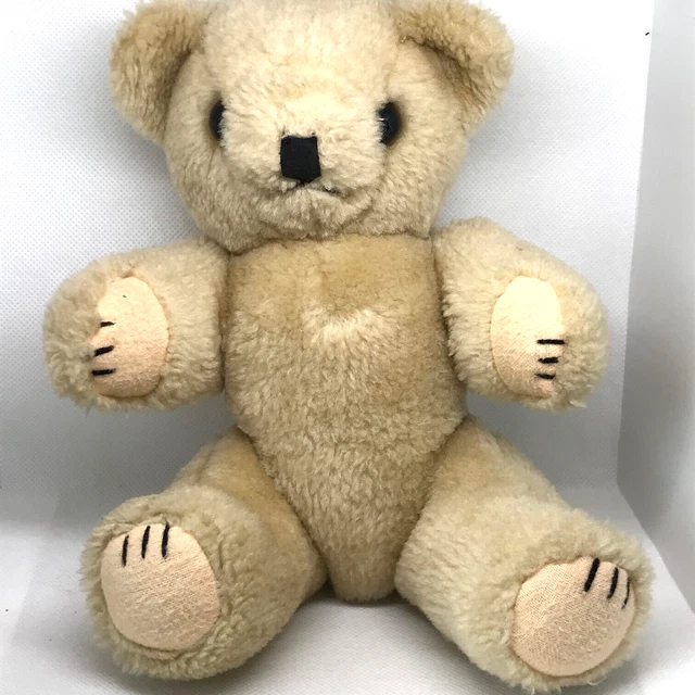 Joli Ours articulé bras, jambes en très bon état . Yeux en verre