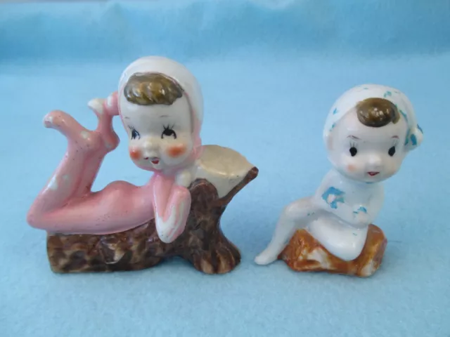 2 Vintage ceramic Pixie Elves 1 pink sitting on logs made in Japan- paint loss