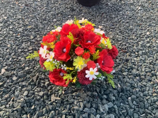 Artificial flower arrangements in grave memorial cemetery pots various colours