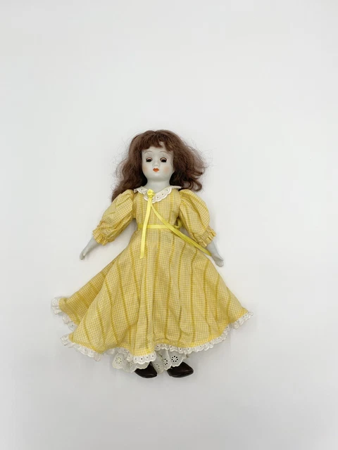 Vintage doll blues eyes brown straight hair, Cloth Body Porcelain 18” Tall.