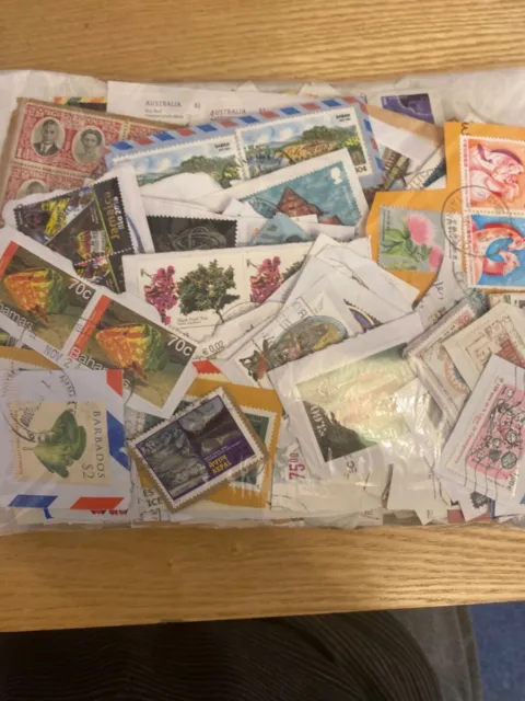 World kiloware stamps on paper Grade A ,100s,  most common stamps taken out