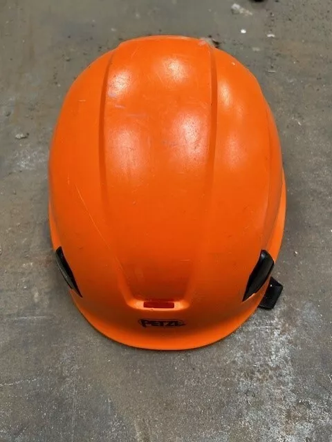 Orange Petzl climbing helmet. Great condition including adjustable chin strap