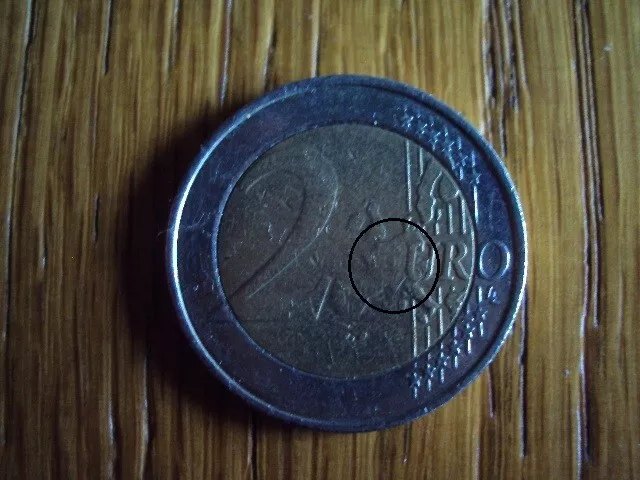 pièce euro fautée 2 euros belgique 2003 le E de euro non lisible peu marqué