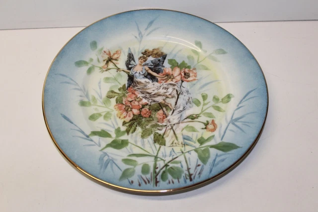 Superbe assiette en porcelaine A.M. La Monaca art nouveau décor elfe et fleurs