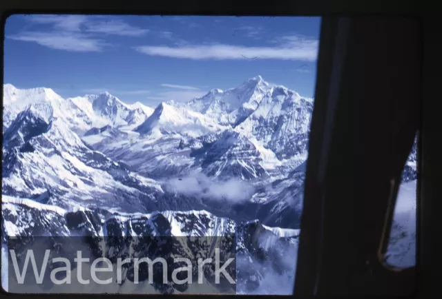 1960s  kodachr. photo slide Royal Nepal Airlines Airplane wing view Mountains 2