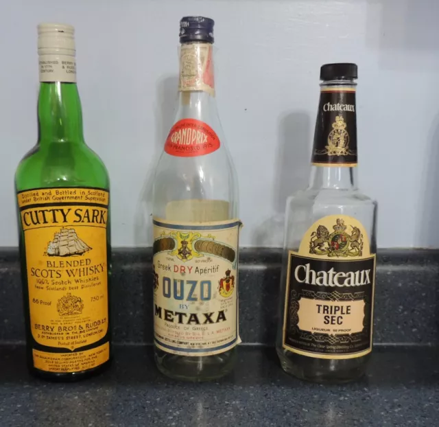 Vintage bottles of CUTTY SARK, METAXA OUZO & CHATEAUX TRIPLE SEC, bar collection