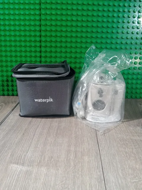 Hilo de agua Waterpik Nano diseño compacto fácil efectivo, WP-310W, con estuche