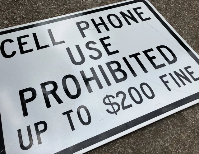 CELL PHONE USE PROHIBITED E Retired highway sign NEVER used Texas Hill Country