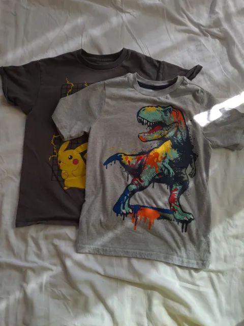 2 Each Youth Size 10 T Shirts. Pokemon Size M.  Graphic Dinosaur Size 10. Clean
