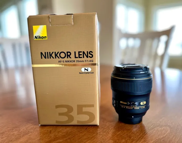 Nikon AF-S Nikkor 35mm f/1.4G lens with lens caps and hood. Near mint condition.