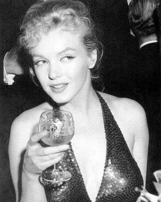 Marilyn Monroe rare candid in low cut sequined dress holding wine 8x10 photo
