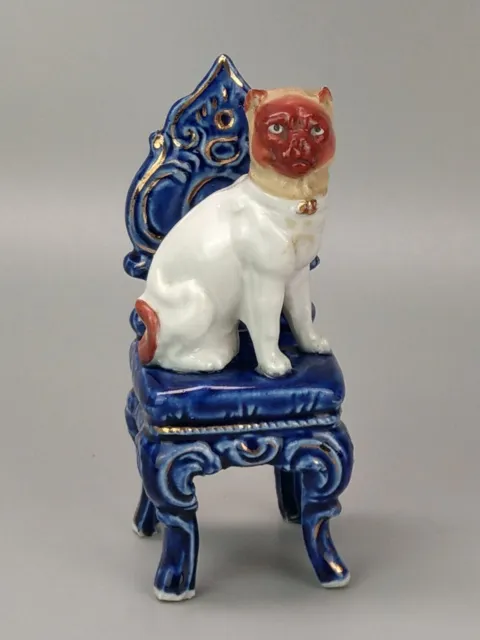 Antique Pug Dog red face on chair Figurine