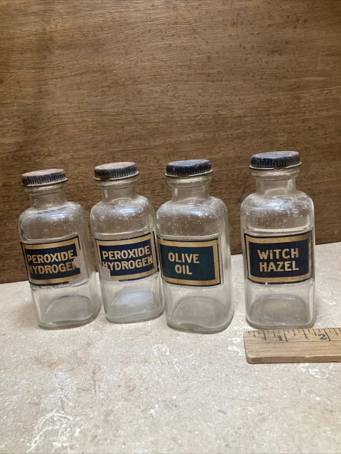 Glass bottles hydrogen peroxide, olive oil,  witch hazel
